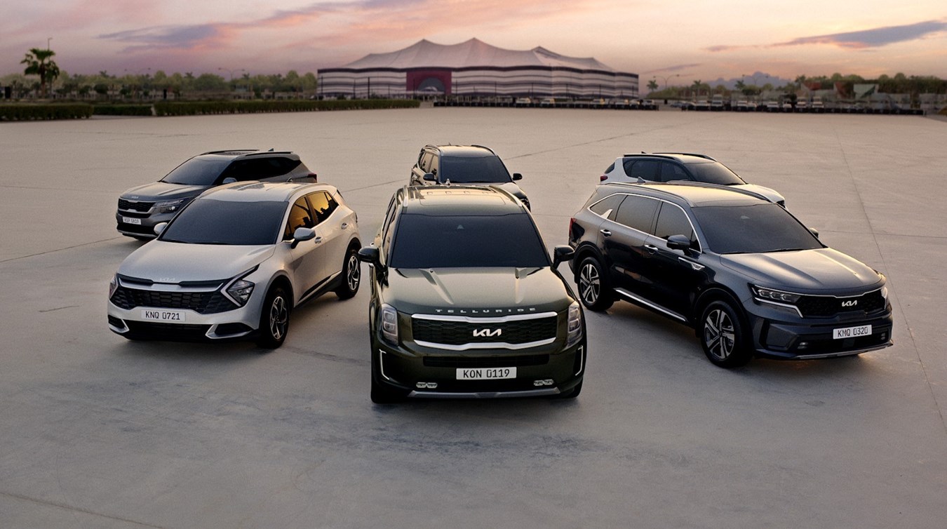The official event vehicles of the FIFA World Cup 2022™ provided by Kia are lined up in front of Al Bayt Stadium